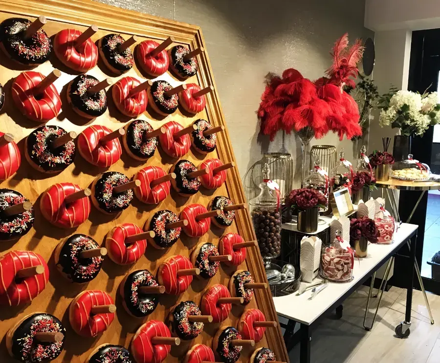 Luxury donut wall hire Australia styled for a corporate celebration