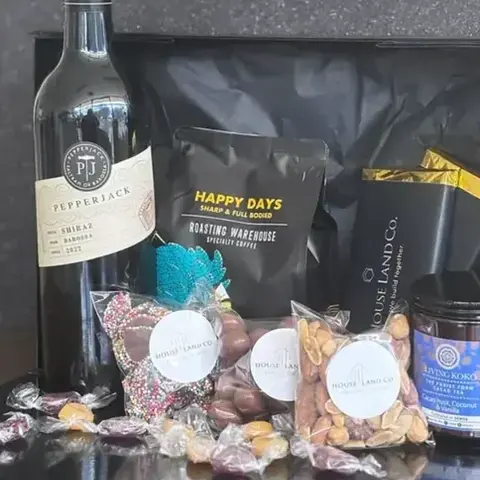 Luxury hampers paired with themed custom chocolate bars styling - custom chocolate wrappers